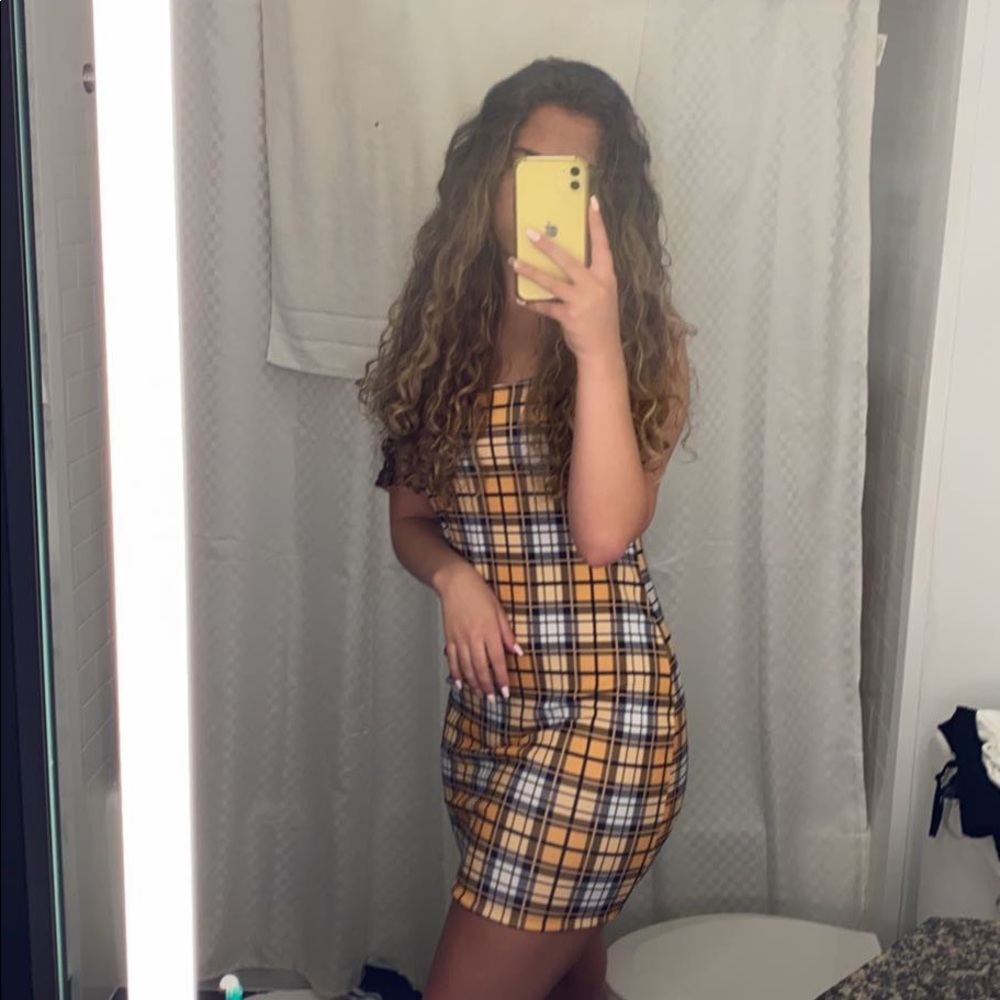 Yellow form fitting summer dress.
